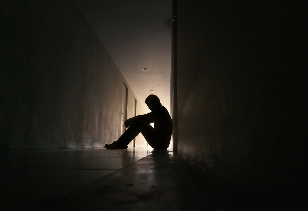 Silhouette of  man in depression and poor mental health