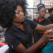 Ugandans young people practice make up art for the motion picture business.